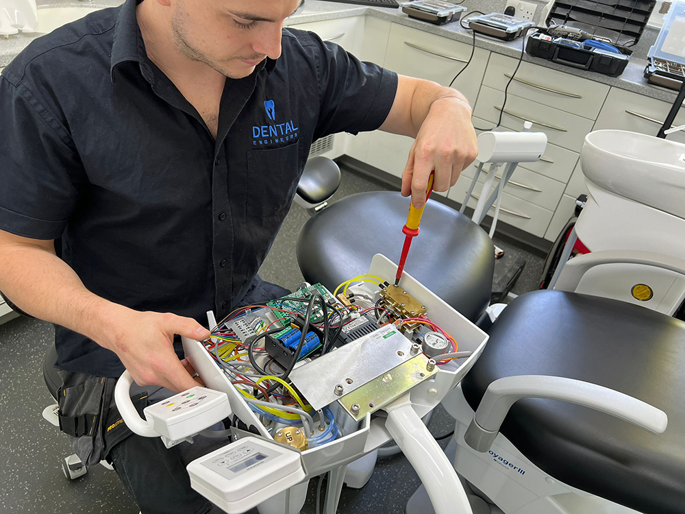 Dental Engineer working on a Belmont Dental Chair